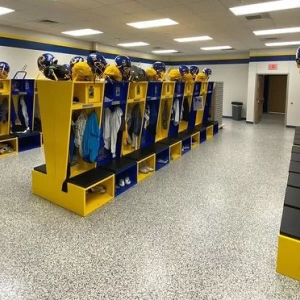 Blue and yellow Flex Elite lockers configured with gear and helmet racks